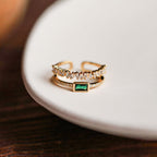Emerald Éternité Ring By hues of jewels On White Plate