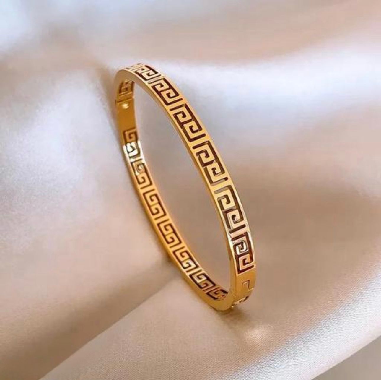 Versace Inspired Bangle  - Gold valerio bracelet with intricate design on a soft fabric background